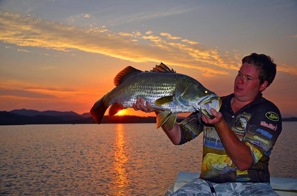 Always be fishing for dusk!  It’s not just a top time to catch a few barra, as Sam McCowan can attest with this 90cm fish, it’s also well worth it for the view © Lee Brake